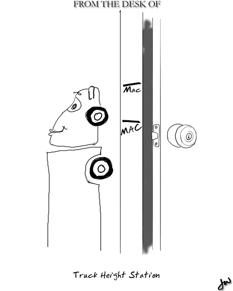 an 18 wheeler truck being measured for height along a presumably very large door frame